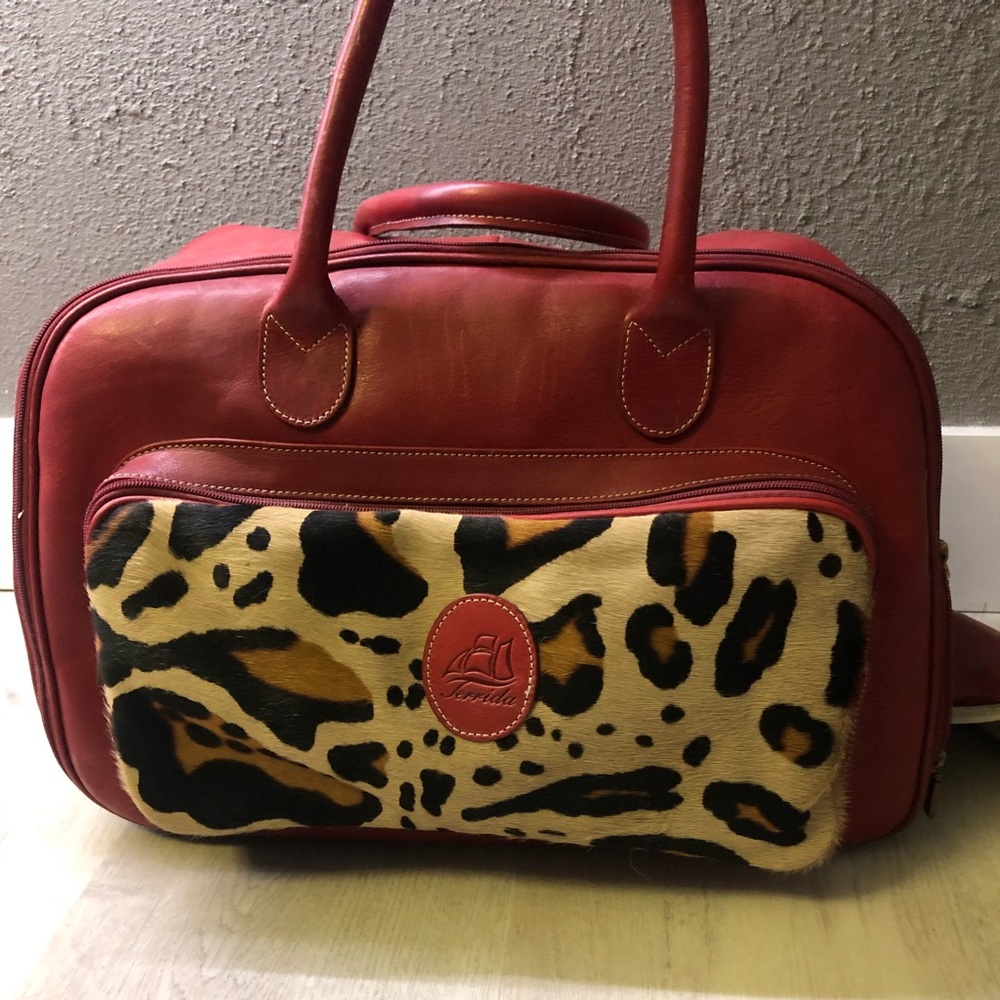 COPY -TERRIDA RED LEATHER BAG W WHEELS FOR TRAVEL